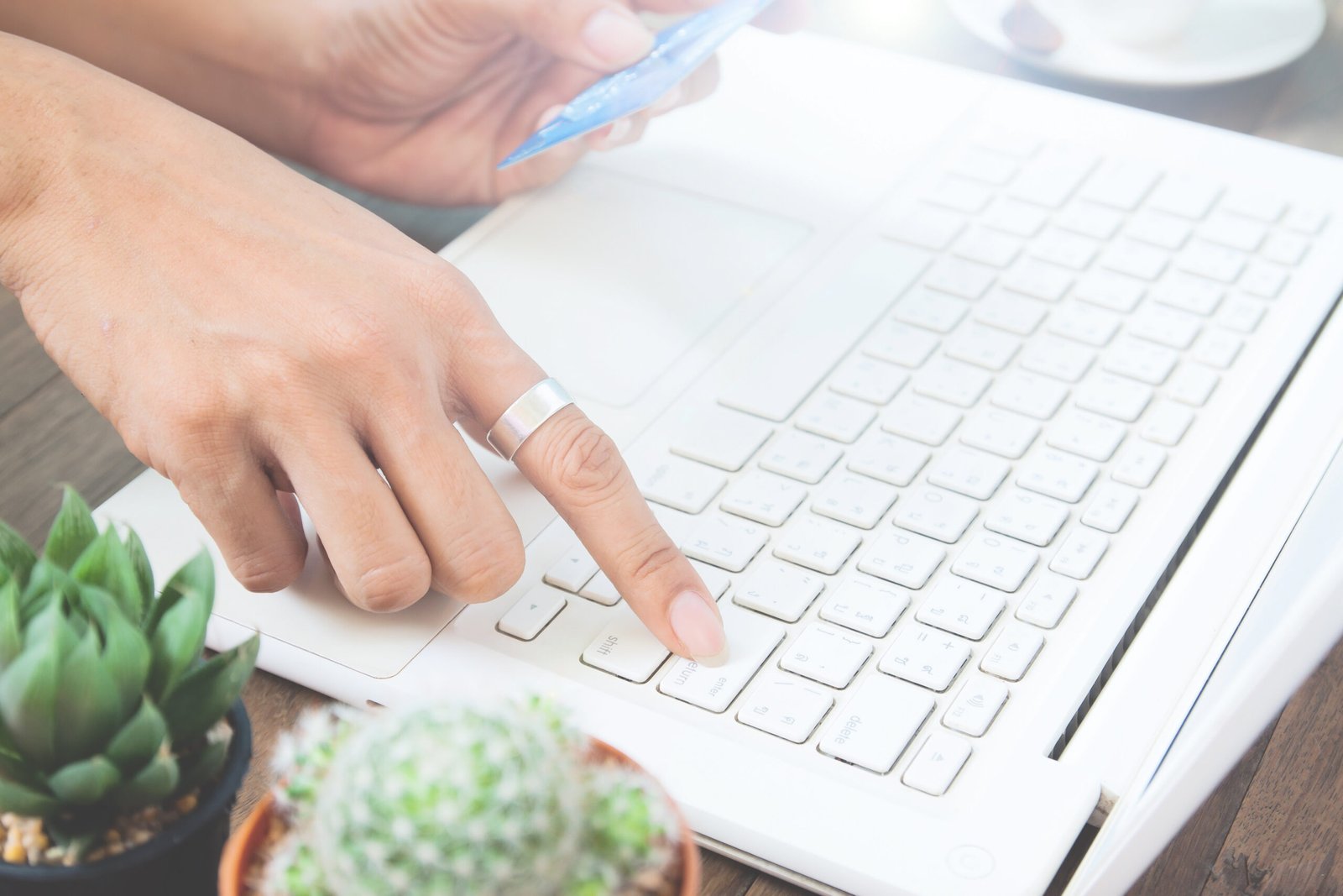 Woman hand using laptop computer and holding credit card, Online shopping